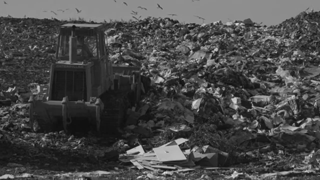 Bulldozer crushing computers at the Logan City Landfill