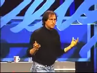 Steve Jobs gesturing to illustrate software complexity