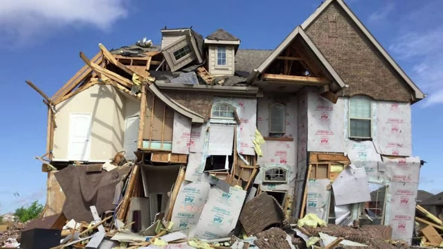 A house partially destroyed, illustrating physical depreciation