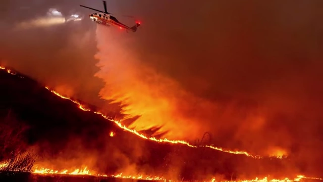 Wildfires being fought by a helicopter in California