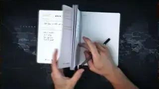 Hands flipping through pages of a physical planner, contrasting with digital apps