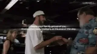 A father is overcome with emotion upon seeing his newly gifted classic car in a garage.