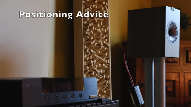 KEF Q150 speakers on stands, with "Positioning Advice" overlaid.