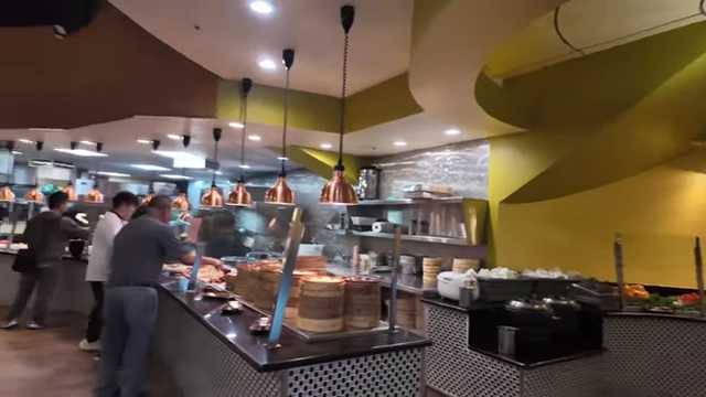 A wide shot showcasing the extensive and long buffet spread.