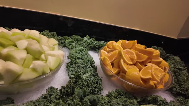 Fresh fruits like honeydew and oranges on the salad and fruit bar.