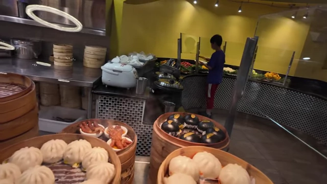 The dim sum station with various steamed buns.