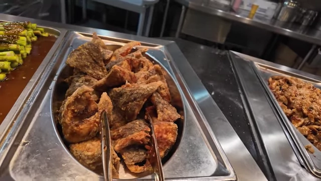 Crispy fried fish pieces available in the hot food section.