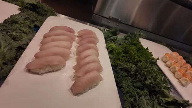 Fresh hamachi nigiri in the sushi section.