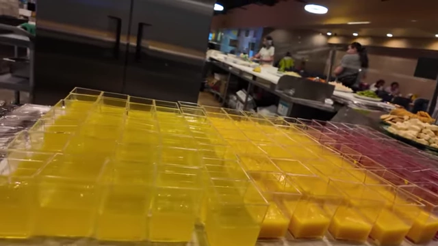 Colorful assorted jellos and cakes for dessert.