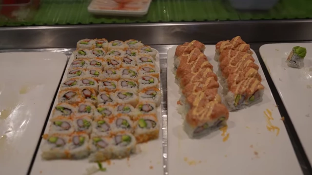 Plates of sushi rolls, noted for their potentially high rice-to-filling ratio.