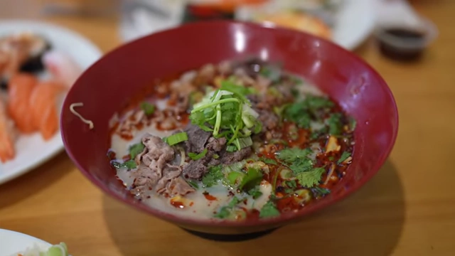 A bowl of Mala Malatang with beef and noodles, customized with extra spice.