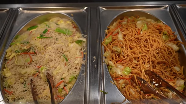 Trays of stir-fried vermicelli noodles and chow mein.
