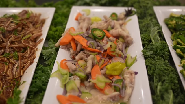 Chicken feet prepared as a cold appetizer with vegetables.