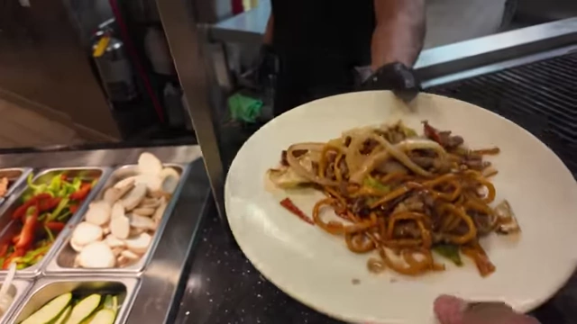 A fresh plate of Teppanyaki with noodles, lamb, and cabbage.