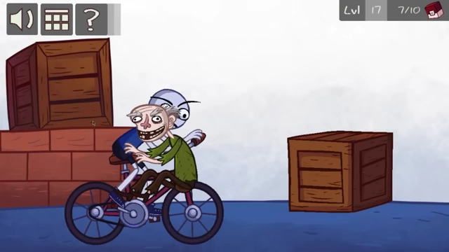An old man on a bicycle is positioned between two wooden crates