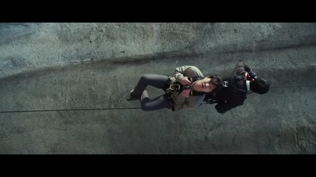 Hae-jun rappels down a cliff, a visual metaphor for his descent into mystery and the film's downward trajectory.
