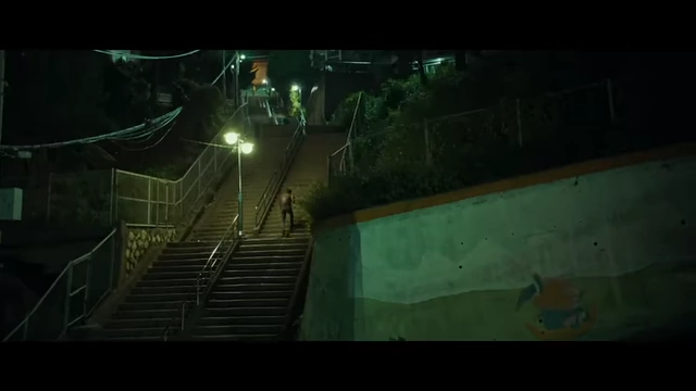 Hae-jun ascends a long flight of stairs, symbolizing a struggle for resolution or climbing a mountain of answers.
