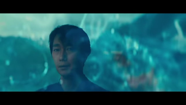 Hae-jun's face reflected through undulating water, visually connecting him to the "jellyfish" metaphor of pushing away problems.