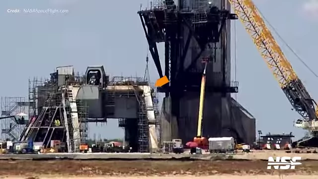 Final pieces of the flame trench wall being lifted into place at Pad 2