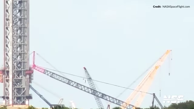 The new LR11000 crawler crane being raised at Launch Complex 39A