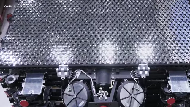 A stack of Starlink satellites inside the fairing
