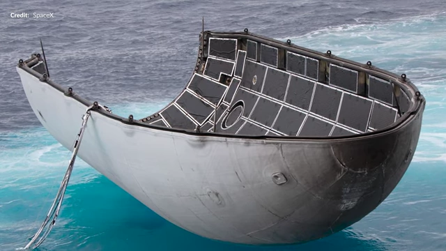 A recovered Falcon 9 fairing half floating in the ocean