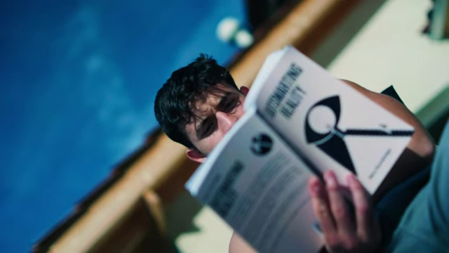Reading a book during a phone detox to engage in mindful activities