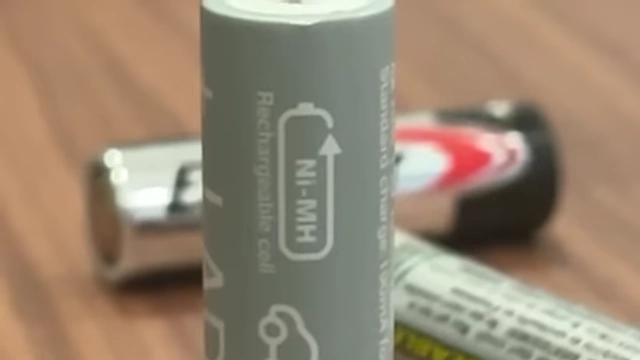 A close-up of a NiMH rechargeable AA battery