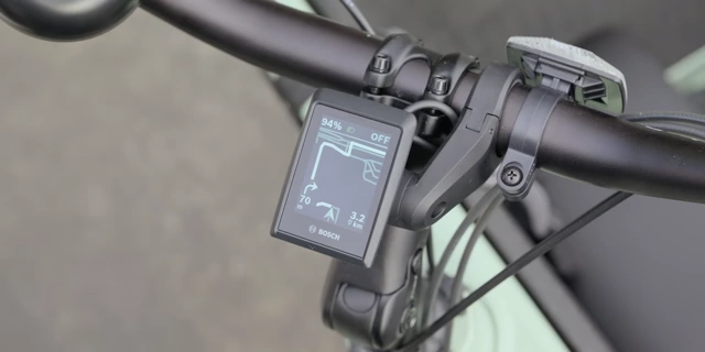 The e-bike's integrated display showing navigation instructions and ride data.