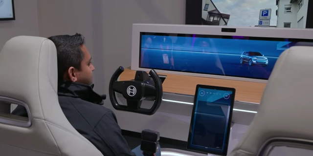 A person interacting with the Bosch Smart Cockpit simulator, featuring an AI-powered display.