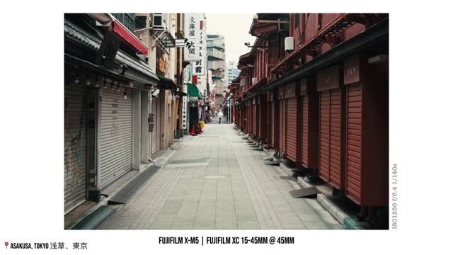 An empty street with traditional Japanese buildings and closed shops in Asakusa, highlighting the serenity of an early morning photo walk.