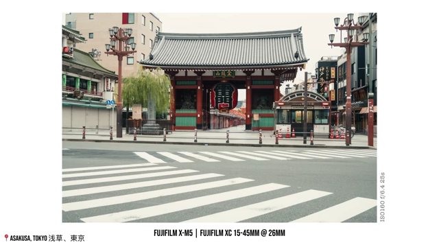 A wide shot of an empty street and crosswalk in Asakusa in the early morning.