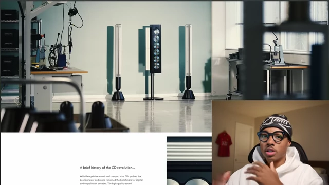 A Bang & Olufsen Beosound 9000 CD player flanked by tall speakers in a minimalist setting