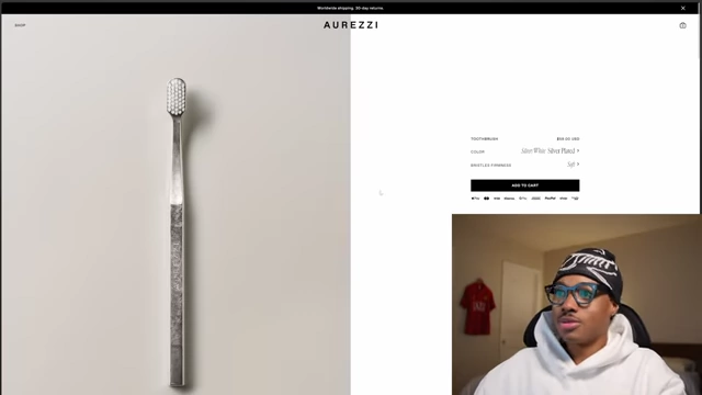 A product image of a sleek, silver-plated manual toothbrush from Aurezzi