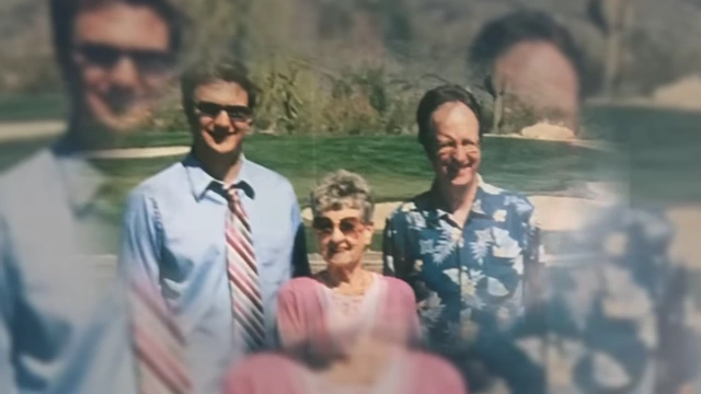 A family photo featuring the speaker, his father, and his grandmother, representing their close bond.