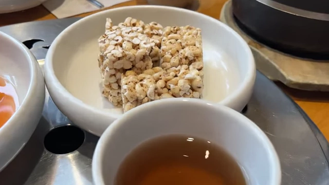 Sweet cold tea and puffed barley snacks