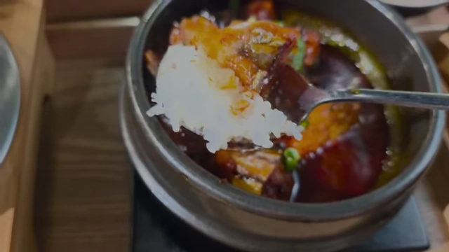A spoonful of braised mackerel and rice