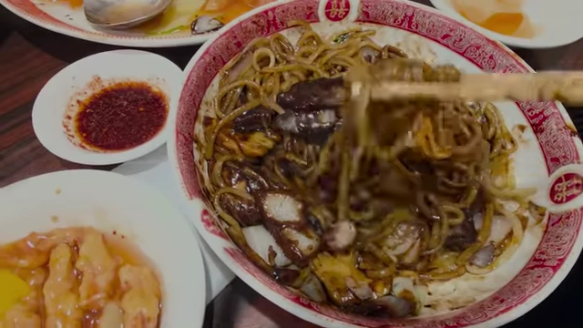 Seafood jjajangmyeon being mixed