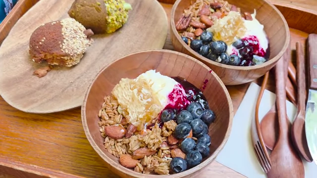 Blueberry yogurt bowls with granola, blueberries, honeycomb, and acorn pastries