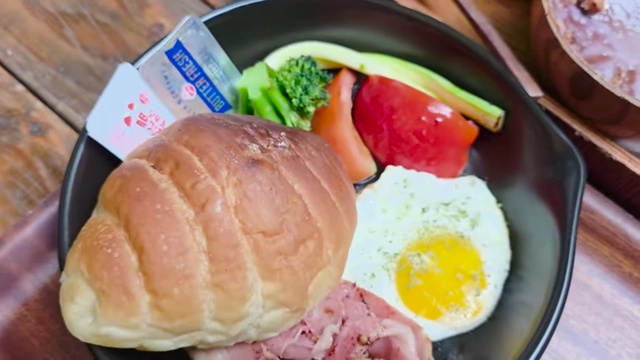 Shio brunch plate with salt bread, turkey bacon, vegetables, and an egg