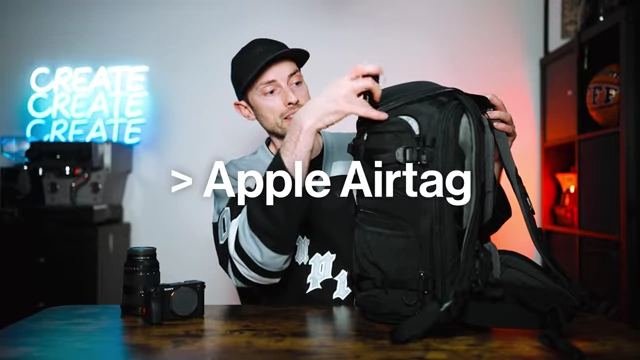An Apple AirTag tucked into a side pocket for tracking