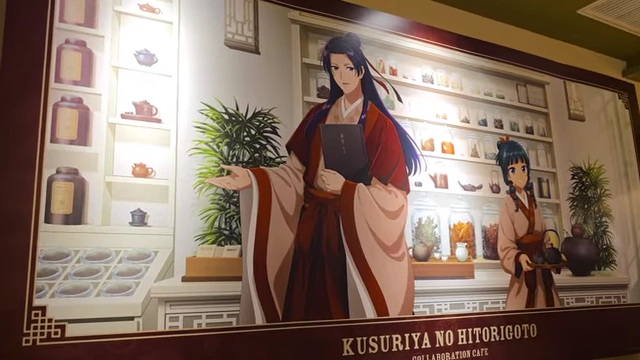 Wall art inside the Apothecary Diaries cafe, featuring characters in an apothecary setting.