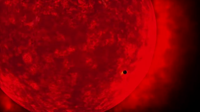 An artist's rendition of our sun expanding into a red giant, illustrating its eventual engulfment of Earth and Moon.