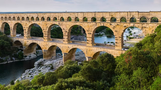 The Pont du Gard, a Roman aqueduct, showcasing ancient human engineering to bring water where needed.