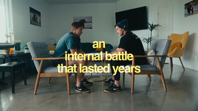 Evan and Jai sitting opposite each other with the text "an internal battle that lasted years", representing his prolonged struggle with commitment.
