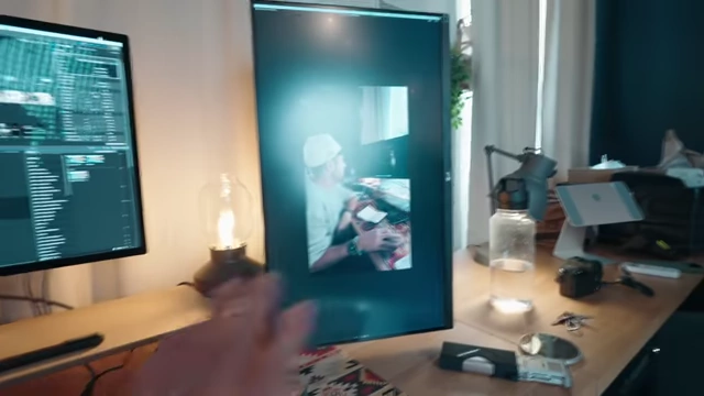 Secondary monitor in vertical orientation, used for reviewing vertical video content and productivity