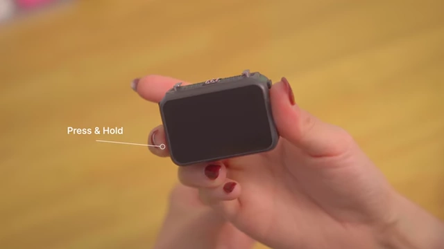 DJI Osmo Nano requires pressing and holding a button for power