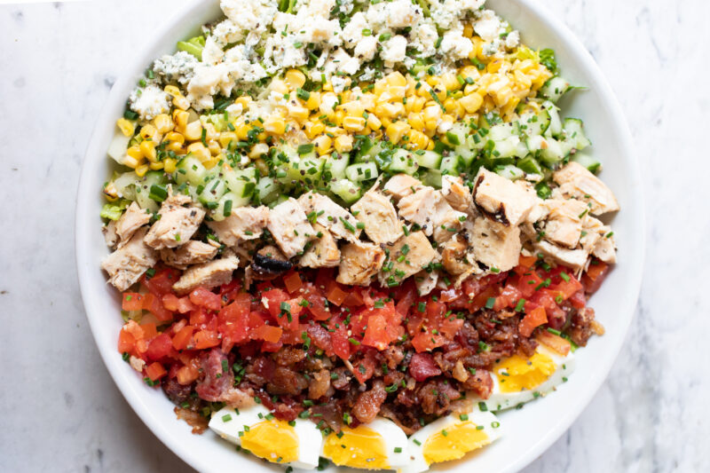 An overheard shot of the Summer House Cobb Salad available on the DwellSocial delivery menu.