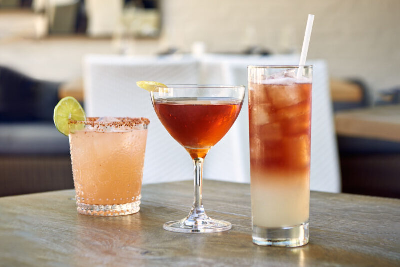 Three cocktails on a table.