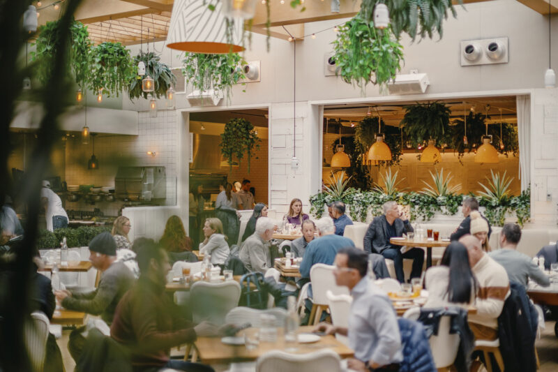 Dining room in Summer House with tables full of people